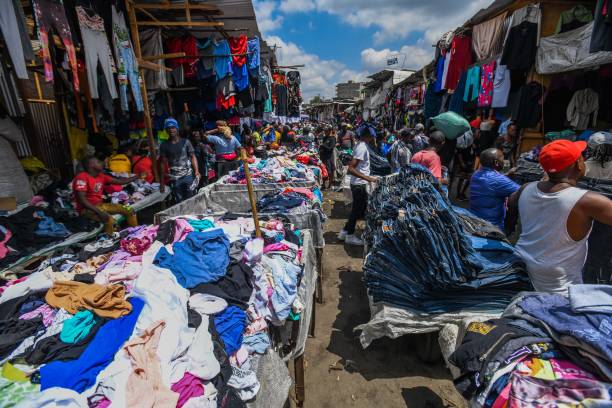 NAIROBI, KENYA - Citizens shop at Gikomba, one of the main market place selling second-hand clothes, as citizens with low income show interest to the market place in Nairobi, Kenya. Kenya imports about 100 thousand tones second-hand clothes annually, generating income for the country and providing employment for tens of thousands of people.