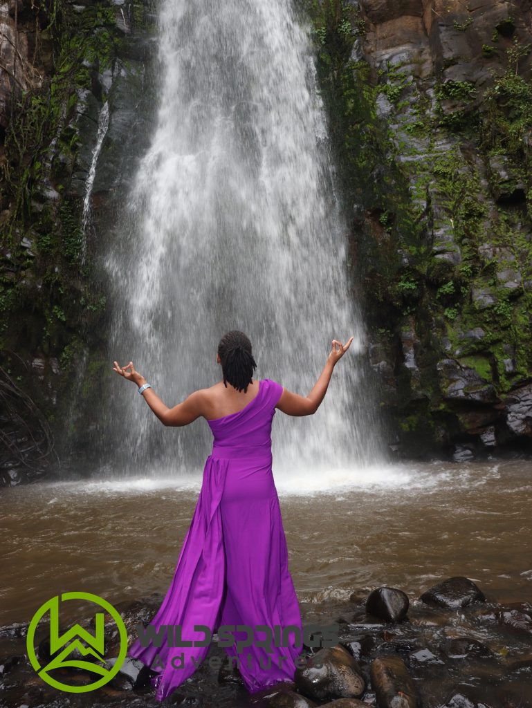 A photo showing a tourist enjoy waterfall chasing experience at 